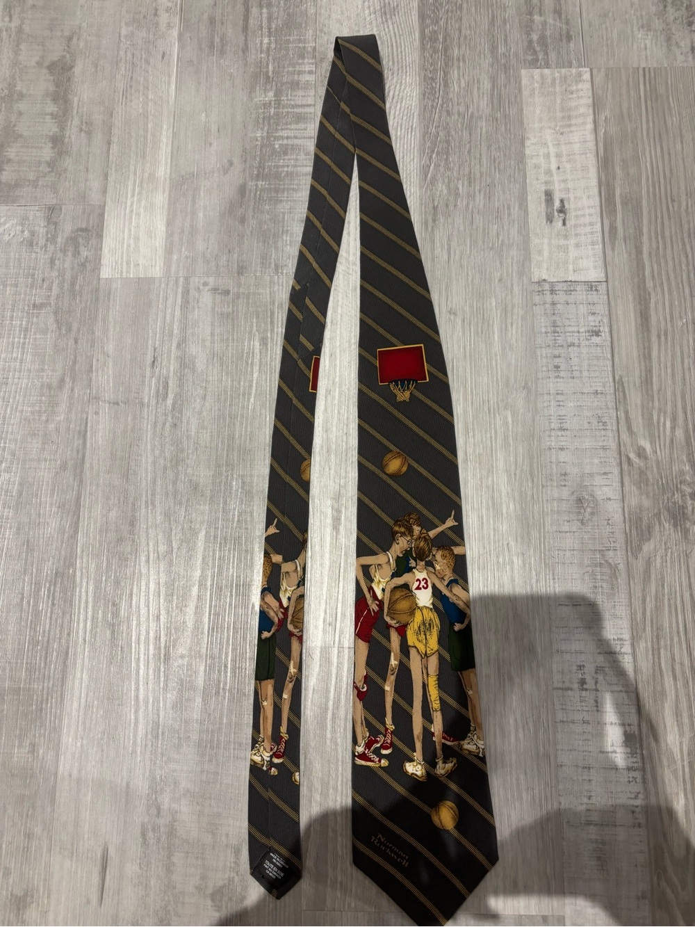 Vintage Brown & Bigelow necktie featuring Norman Rockwell basketball art